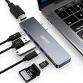 Silver aluminium USB C hub adapter with Thunderbolt 3, HDMI, SD card slots, and USB 3.0 ports