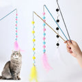 Cat toy teaser stick with plush ball and feathers, approximately 31 cm long, on a plain background.