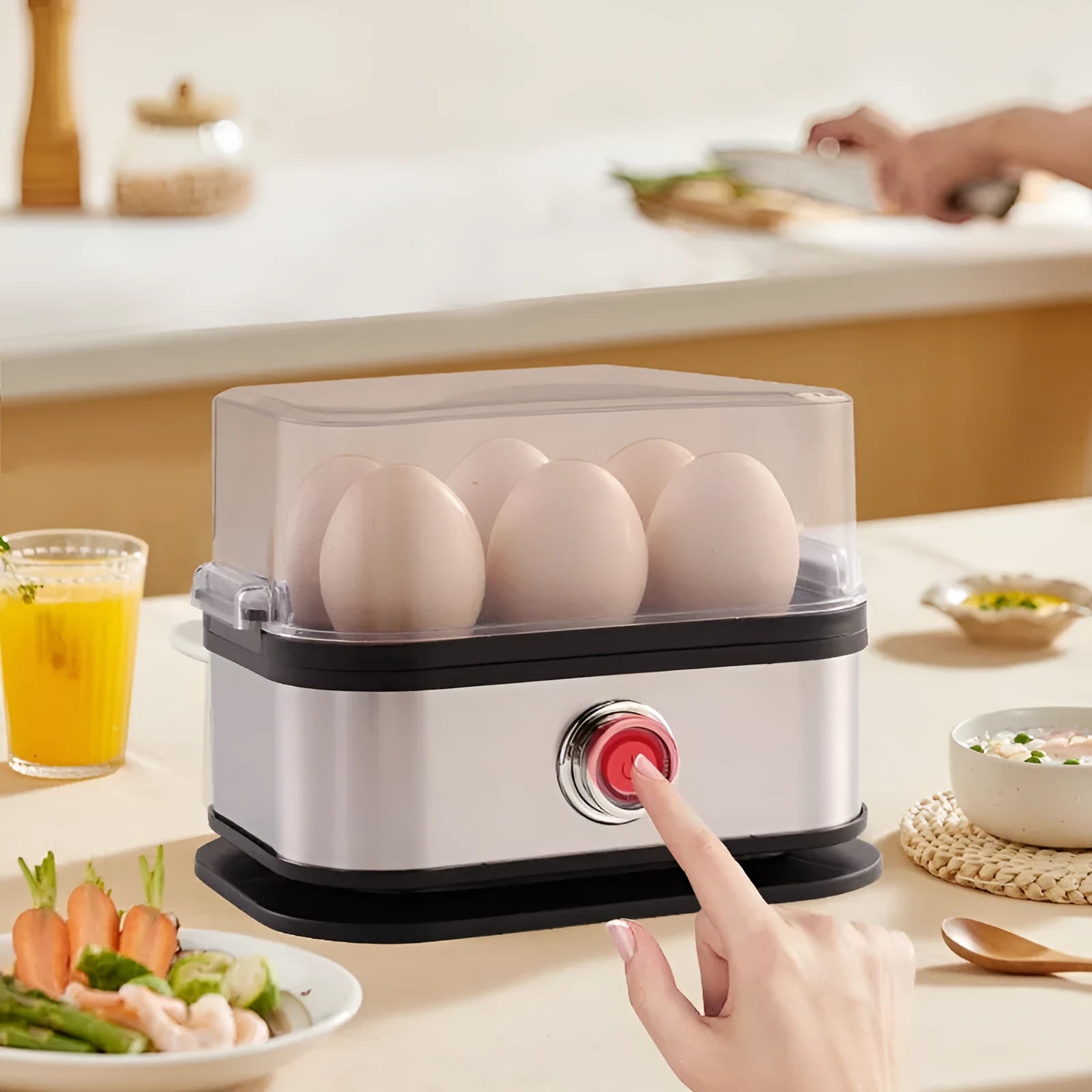 Black portable stainless steel egg boiler with a carrying belt for travel use.