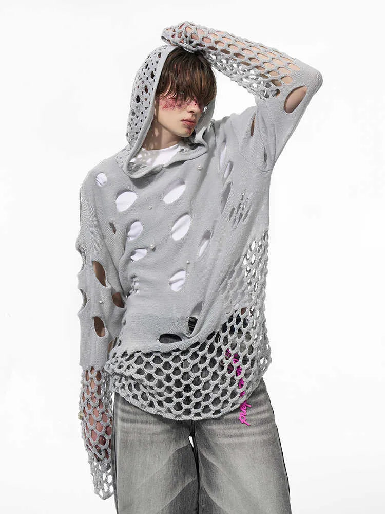 Black men's loose hoodie with a pearl decoration on the hood, shown on a model.
