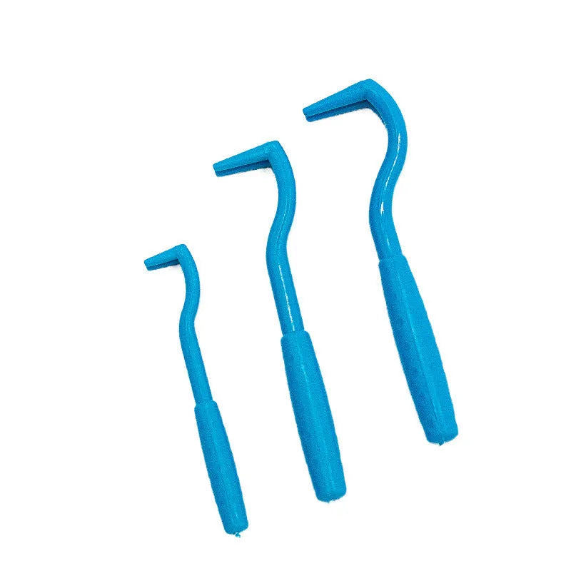 Three plastic pet tick removal hooks in blue and green colours for dog and cat parasite elimination