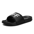 Black and white open-toe men's slippers with a rubber sole, shown on a size chart from 36 to 46.