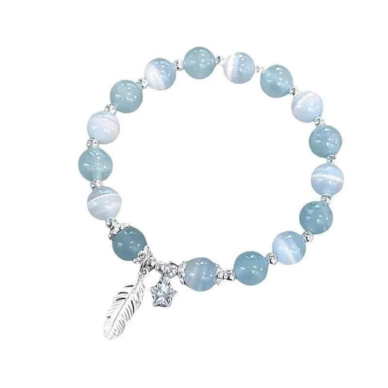 Small white crystal bracelet with blue moonlight colour and star design, Korean-style glass jewellery.
