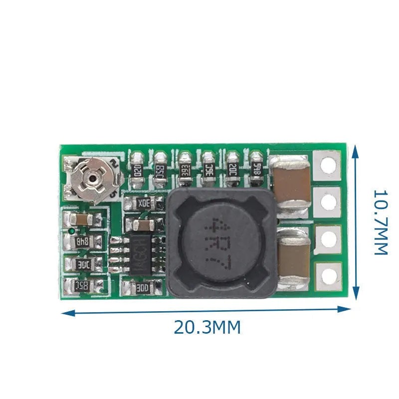 Green PCB mini DC-DC step down power supply module converting 12-24V to 5V 3A.