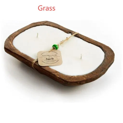 Lavender-scented soy wax candle in a wooden basin with a wooden wick