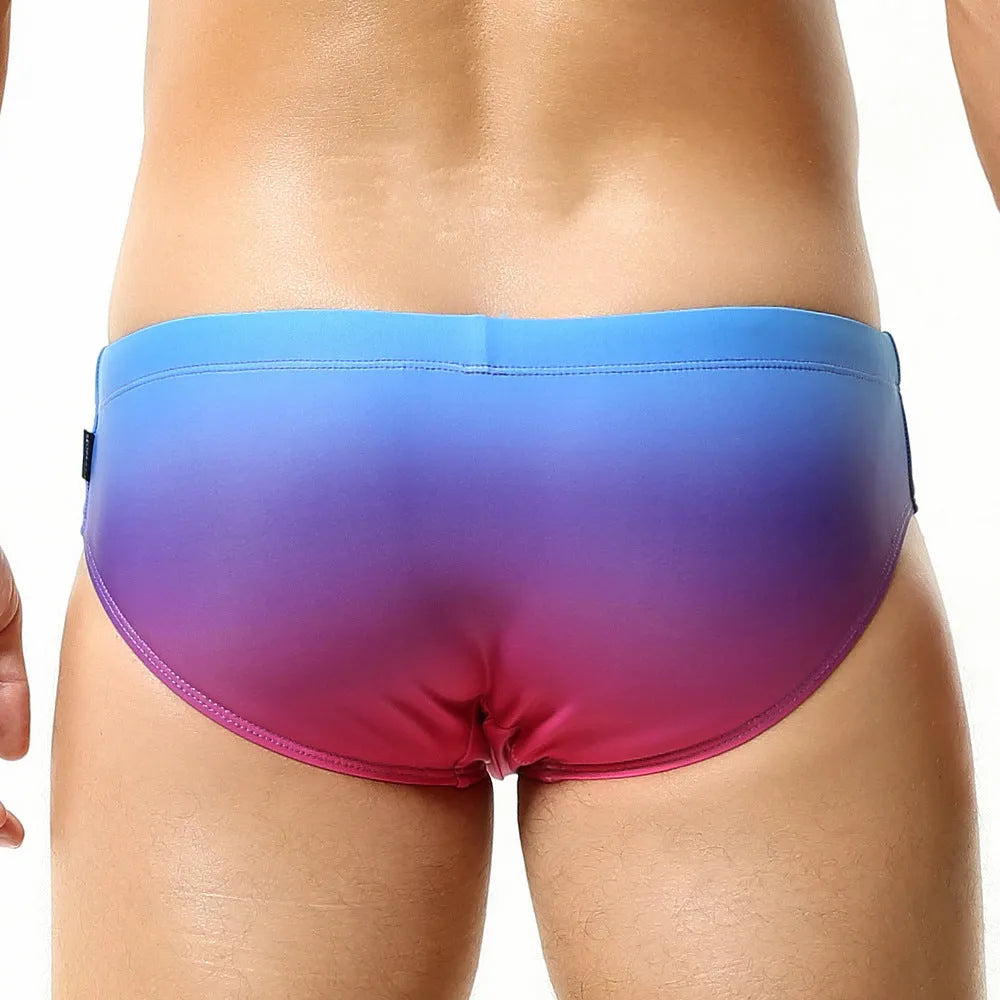 Men's solid colour polyester swim trunks in briefs style for swimming.