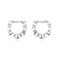 Pair of sterling silver geometric earrings with retro style and round elements