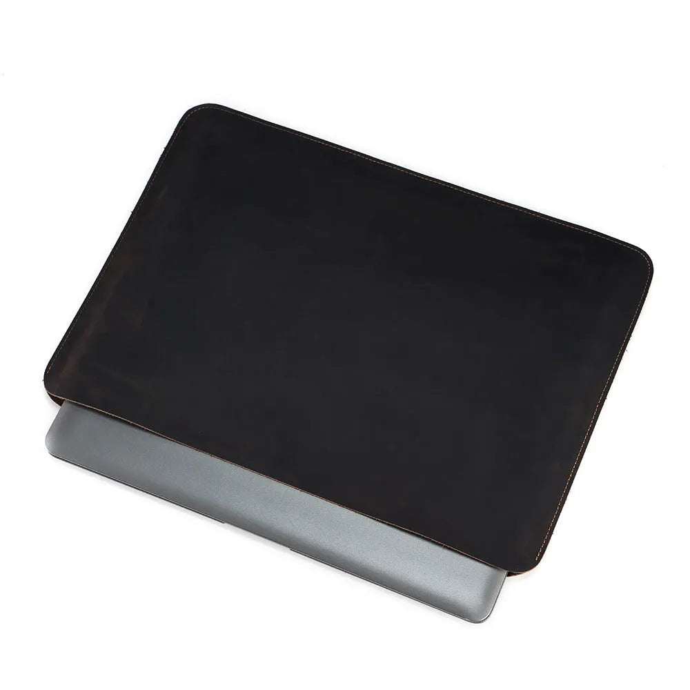 Brown genuine leather horizontal computer bag liner organiser with a laptop inside