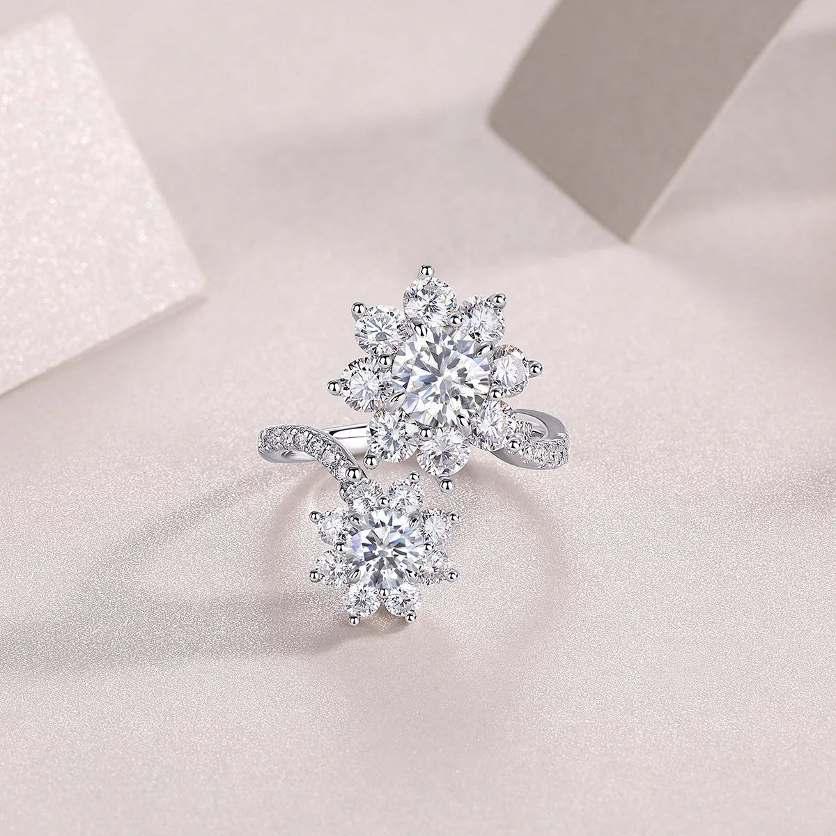 1 carat moissanite wedding ring set in S925 silver with platinum plating on a white background with gift box