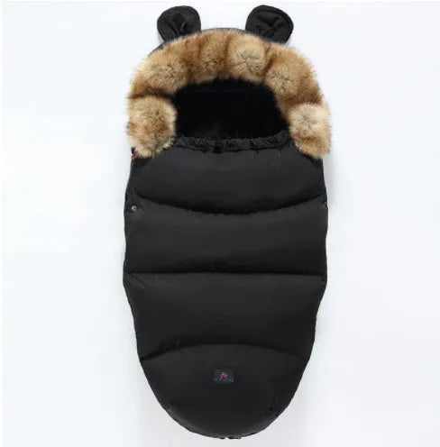 Baby warm cocoon style sleeping bag on a neutral background demonstrating solid colour design with zip closure