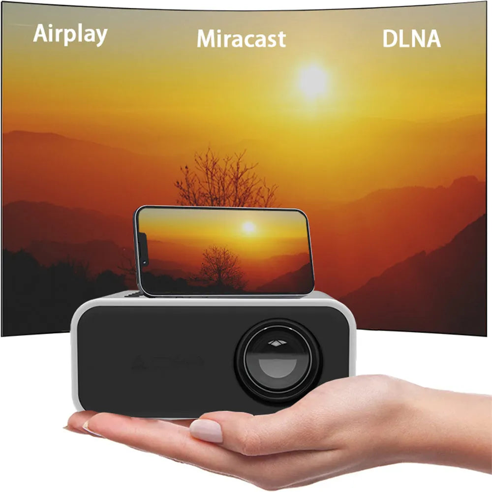 YT300 black or white portable mini projector with remote control on a table, showing compact size.