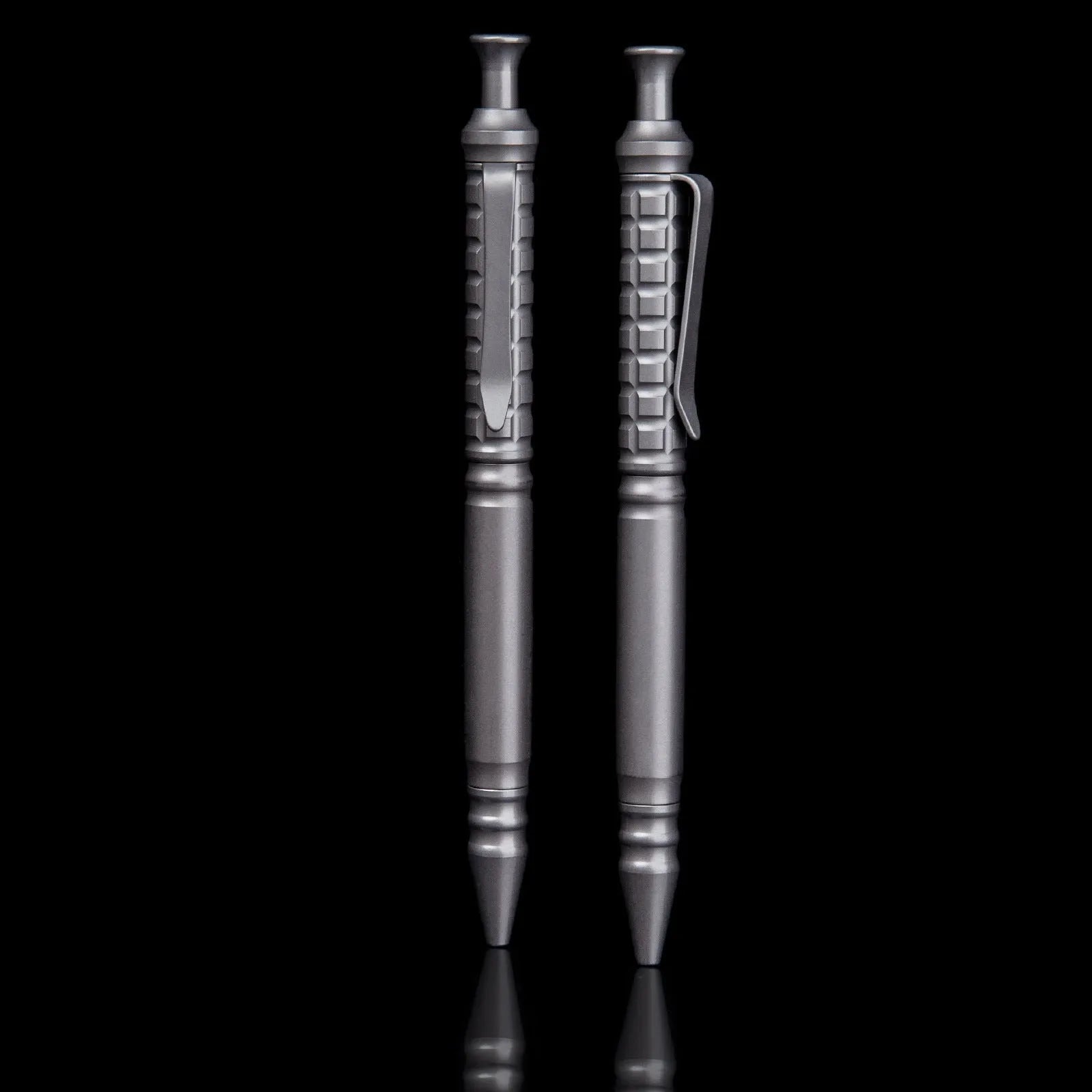 Gunmetal grey titanium alloy tactical pen with push-action mechanism and 0.5mm nib in a gift box.