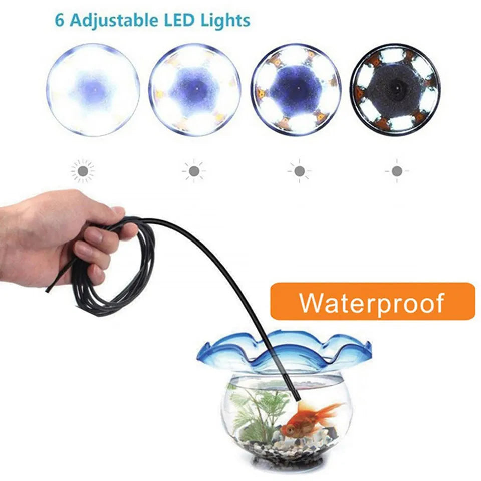 USB-C endoscope with waterproof camera, flexible black cable, and separate hook, magnet, and side mirror attachments on a table.