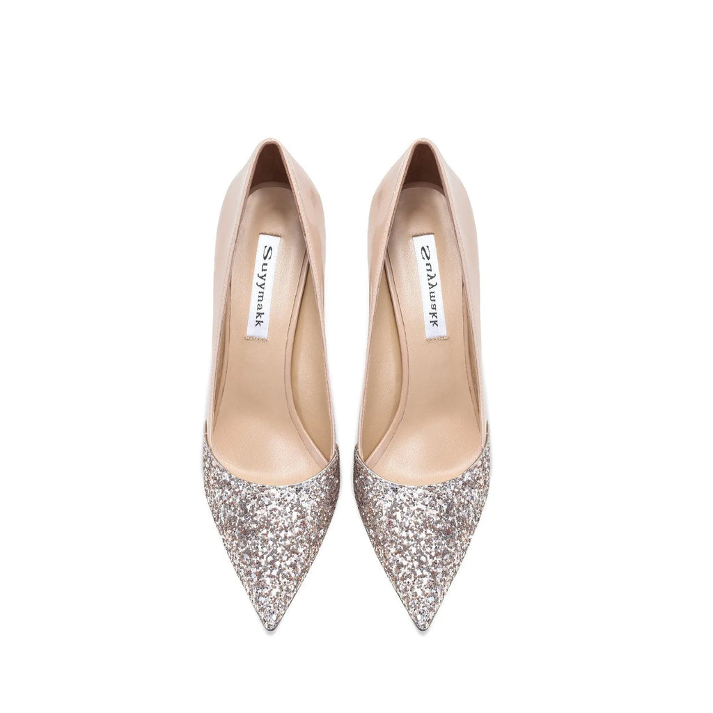 Women's patent leather pointed toe high heels with gold sequin stitching, available in nude or black with thin heel