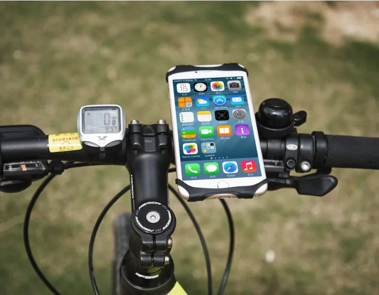 Black silicone bicycle phone holder mounted on handlebars showing three-hole adjustable bracket