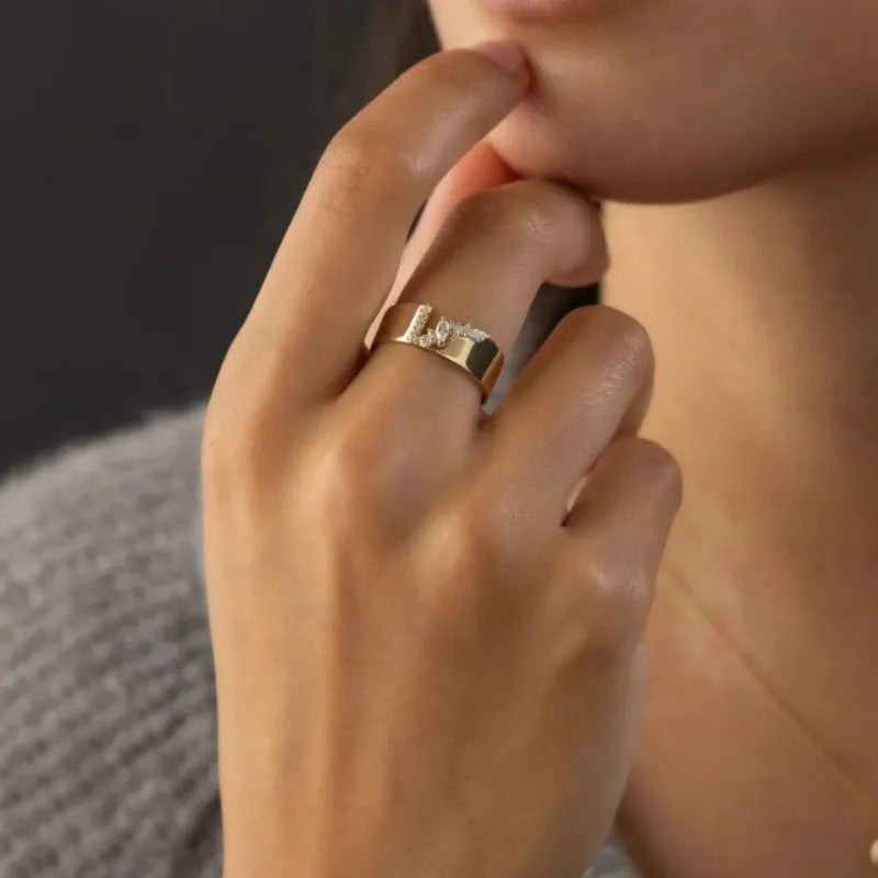 Gold electroplated copper women's ring with a cubic zirconia stone, shown in size 8.