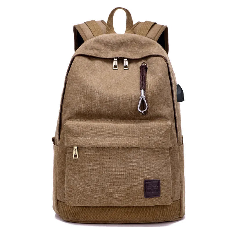 Canvas backpack with USB charging port shown in grey colour, featuring multiple pockets and straps.