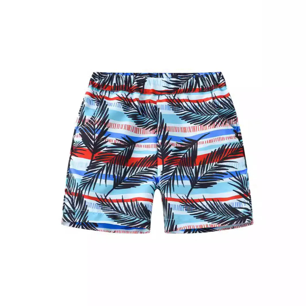 Printed beach shorts with elastic waistband in multiple colour patterns including coconut trees and pineapple design