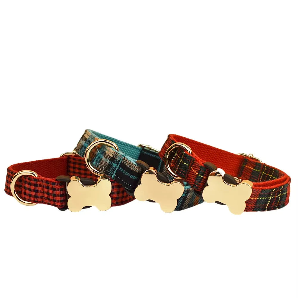 Nylon dog collar with a printed grid pattern and a large bone-shaped metal buckle.