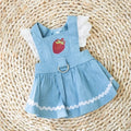 Bondi Blue dog skirt with strawberry print and elastic waistband on a small dog.