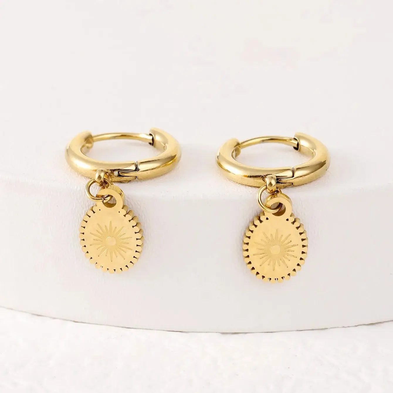 A pair of stainless steel geometric ellipse earrings with an ear button fastening, colour XY-EH005.
