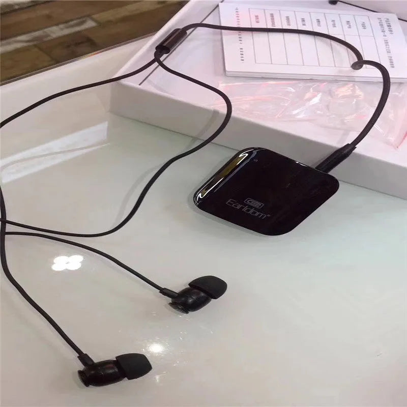 Black Bluetooth lavalier headset with microphone, showing wireless audio receiver unit.
