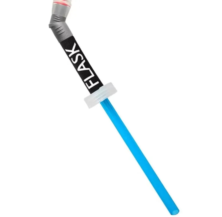Flexible silicone drinking straw with black carabiner clip against outdoor background