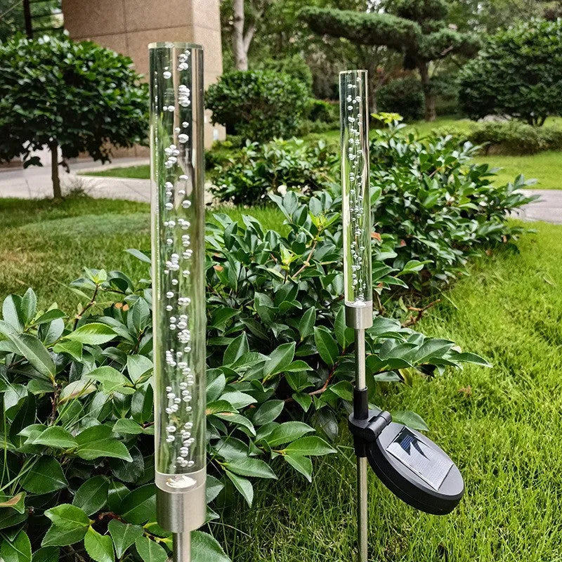 Solar bubble stick lawn lamp with colourful slow flash crystal bubble effect in garden setting