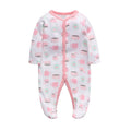 A soft cotton baby one-piece garment featuring a dinosaur print, shown on a hanger.
