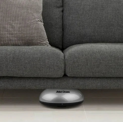 Silver-coloured mini robotic vacuum cleaner with compact dimensions for small space cleaning