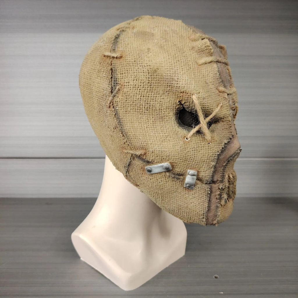Latex Halloween horror mask showing detailed scar skull design as a full head cover.