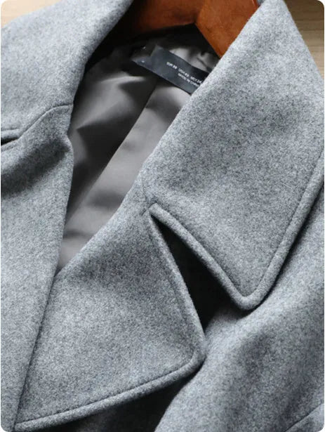 Gray mid-length double breasted woolen coat for women with button front and loose fit
