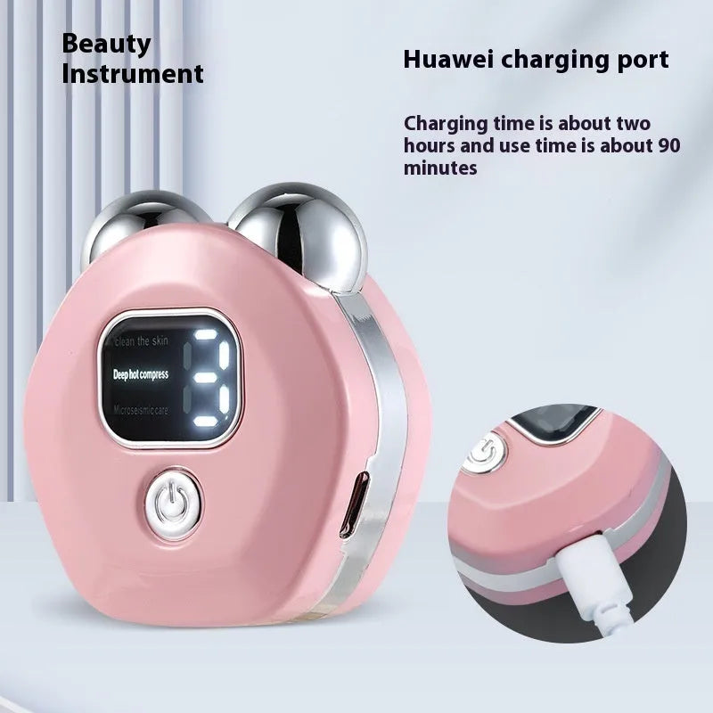 Portable white facial massager with hot compress function and double-roller head on a pink background.