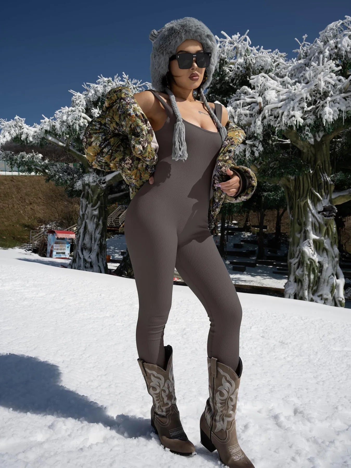 Women's long sleeve spandex suspender tank top tights with button details on a mannequin.