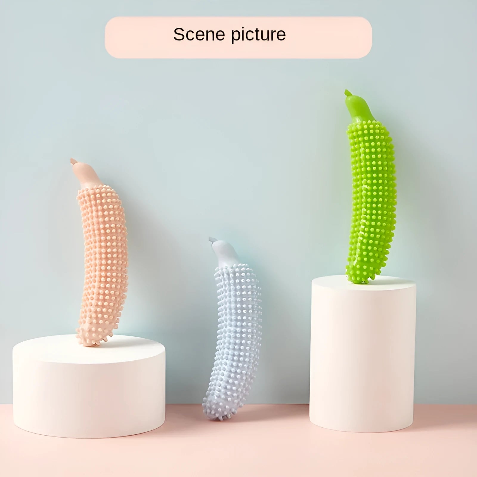 Green cucumber-shaped dog chew toy on a plain background.