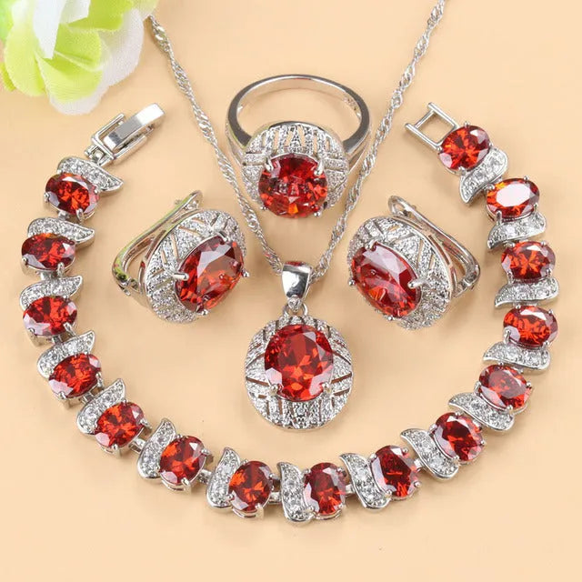Mixed gem-inlaid copper jewellery set including pendant necklace, earrings, ring, and bracelet in green colour