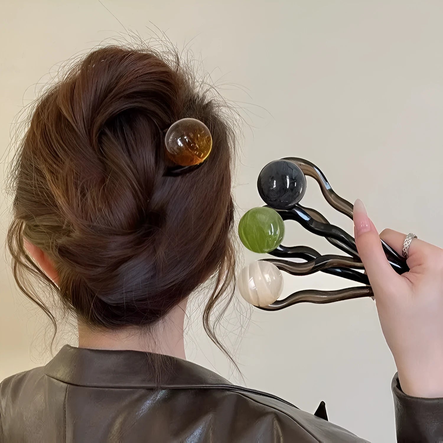 Acrylic U-shaped hair pin barrettes with retro ball decoration in beige, caramel, dark gray, and green colours.