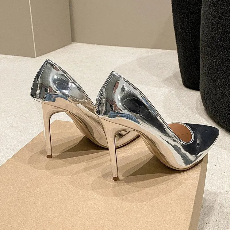 Women's pointed toe stiletto heel pumps in gold and silver colours with slip-on design