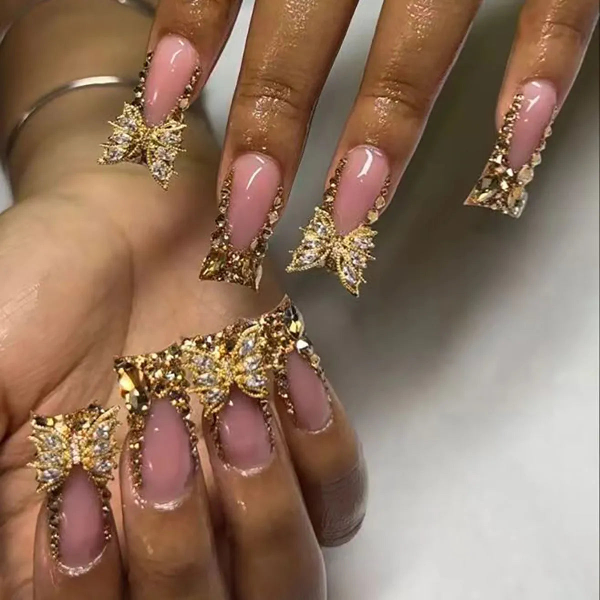 Golden diamond and butterfly design nail stickers in D34 colour with adhesive tube