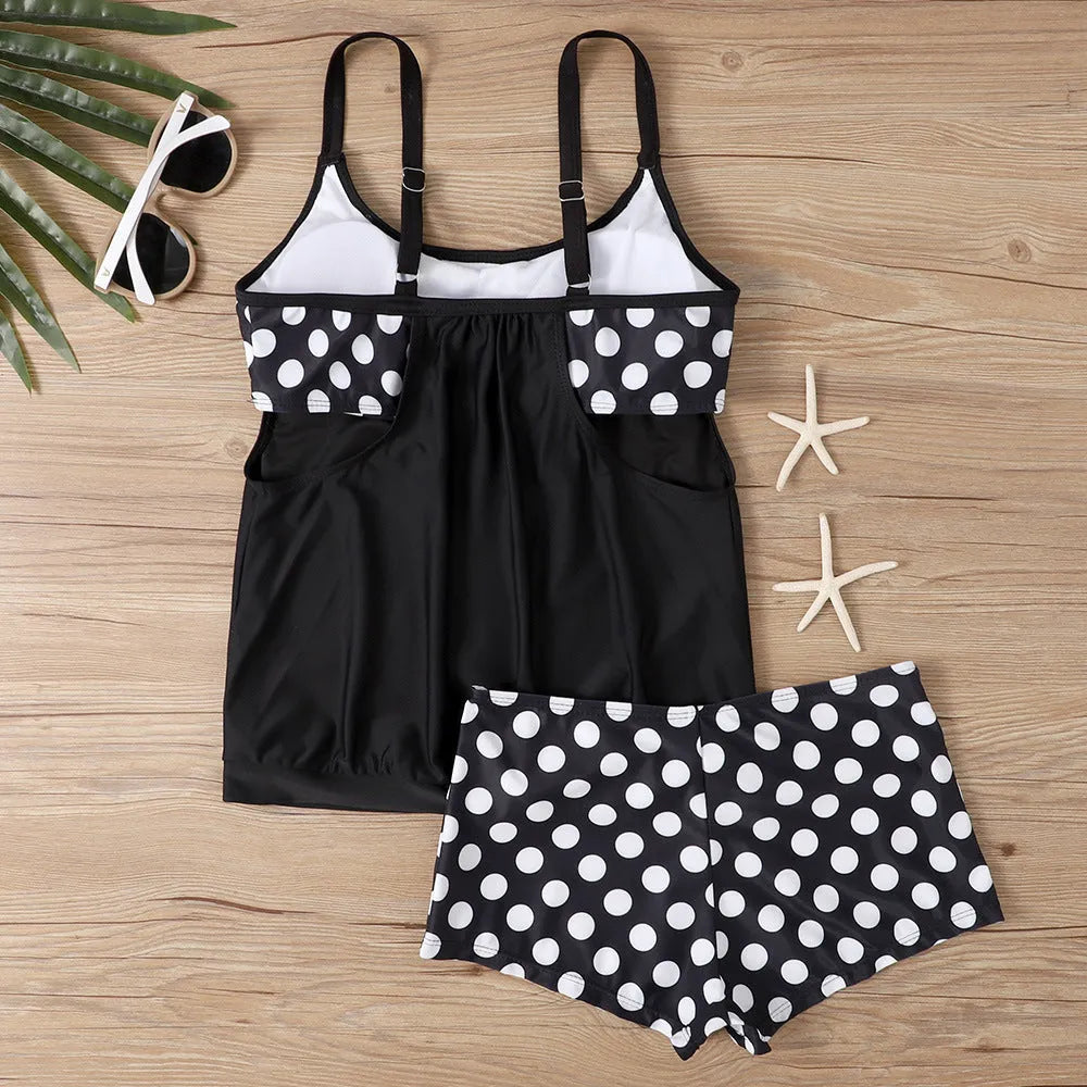 Women's black polka dot high-waist boxer swimsuit briefs on a mannequin.