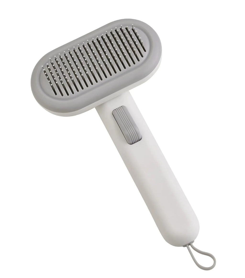 Large pet grooming comb in light grey with stainless steel blades and a one-click cleaning button