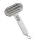 Large pet grooming comb in light grey with stainless steel blades and a one-click cleaning button