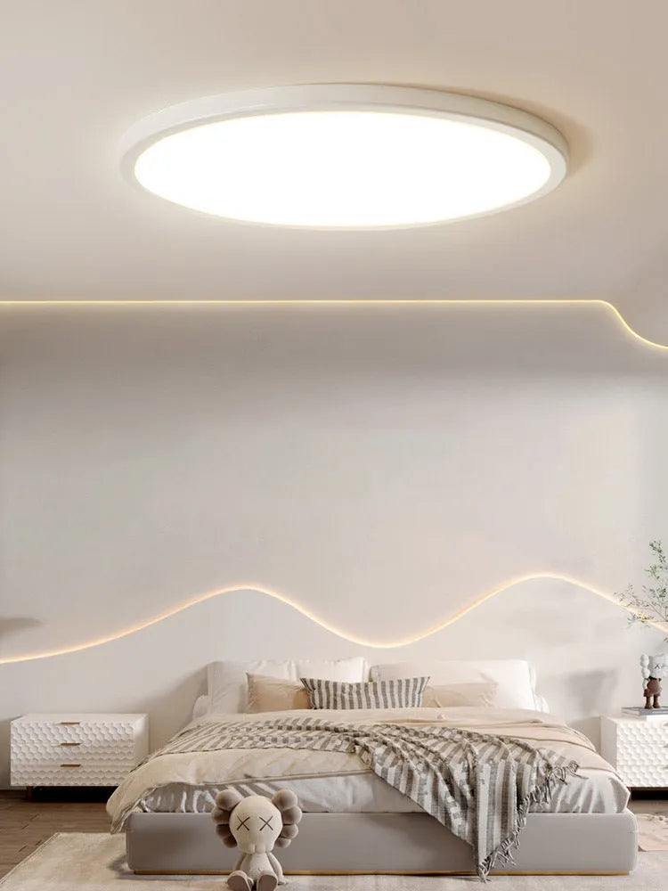 Ultra-thin round white LED ceiling lamp with aluminium frame and acrylic shade on ceiling