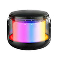 Black gun-shaped Bluetooth speaker with coloured glaze finish on desktop