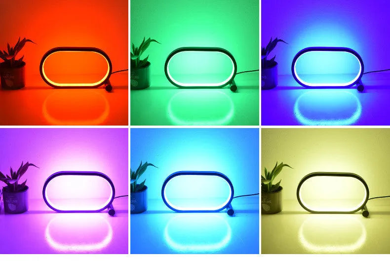 USB plug-in oval acrylic touch dimmable night light with metal base on a desk, black colour