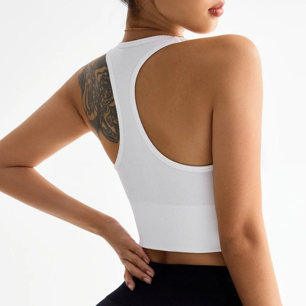 Black women's sports bra with cross-back design and moulded cups for yoga and running.
