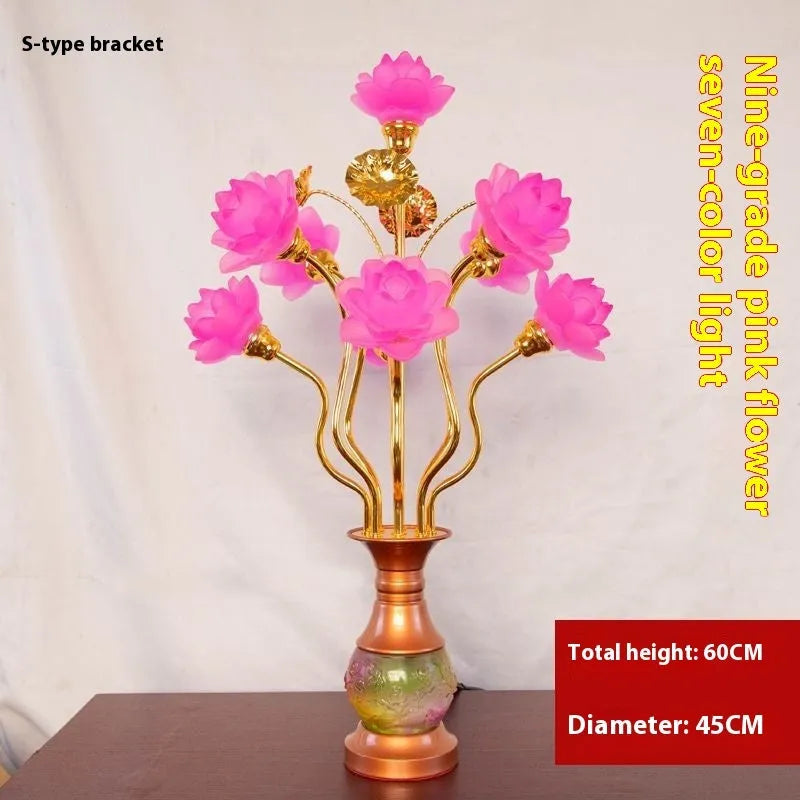 Coloured glaze pink and yellow LED lotus lantern for Buddha worship on an alloy stand.