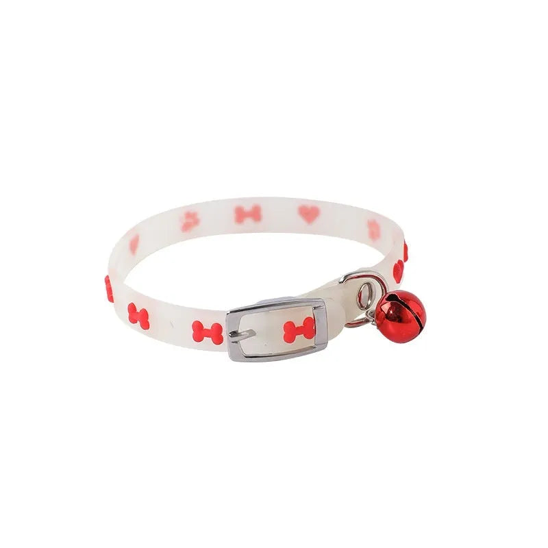 Luminous cat collar with glowing effect, silicone chain, metal bell, in a paw print pattern design.