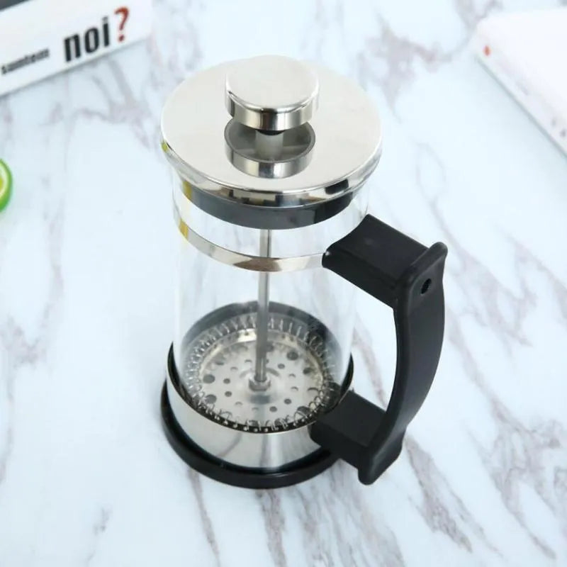 Compact stovetop coffee maker with glass chamber and stainless steel base, showing 350ml capacity.