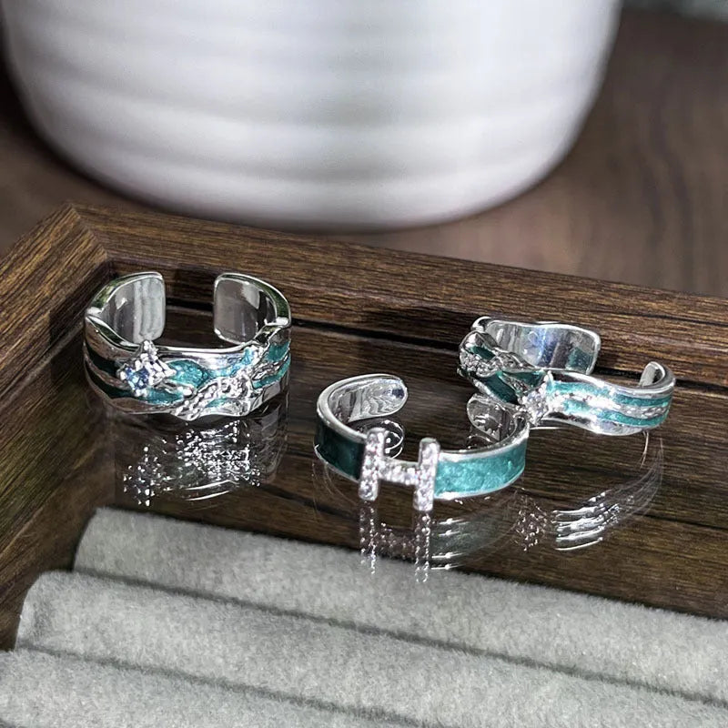 Mint green enamel copper ring with asymmetric folding design and asterism star motif